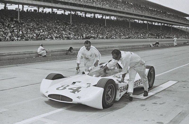 Thompson crew pushes the #84 car for driver Eddie Johnson at 1964 Indy 500